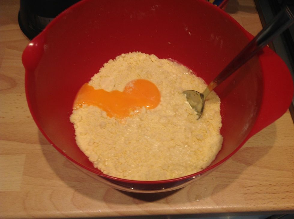 Add the egg yolks and the 2 tbsp of water and mix again