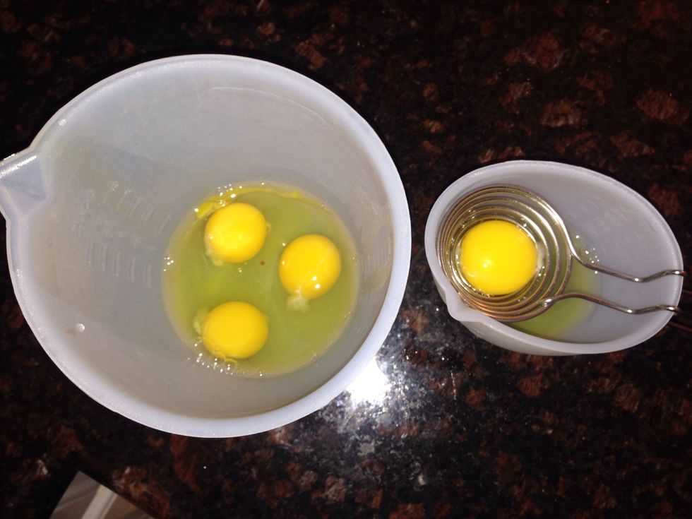 Add the eggs one at a time with mixer on low; 3 eggs and 1 egg separated for 1 yolk. Make sure eggs are well incorporated into the batter.