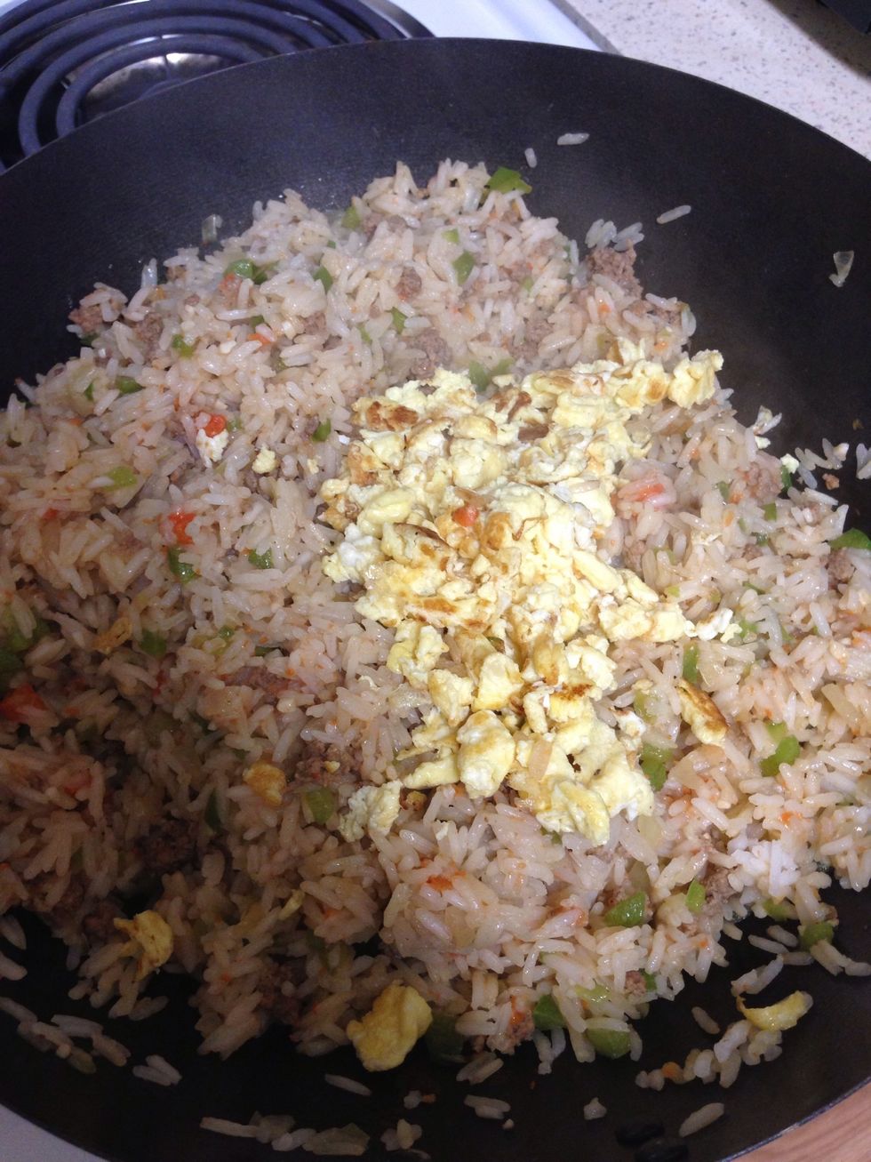 Add the eggs to the rice and try it, cuz it might need more soy sauce, and then add a dash of sugar