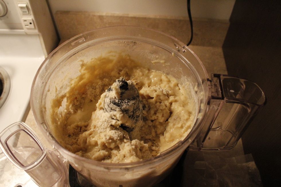 Add the entire package of Red Mill's Gluten Free Pizza Dough and mix until the pizza dough can be formed into two separate balls of dough.