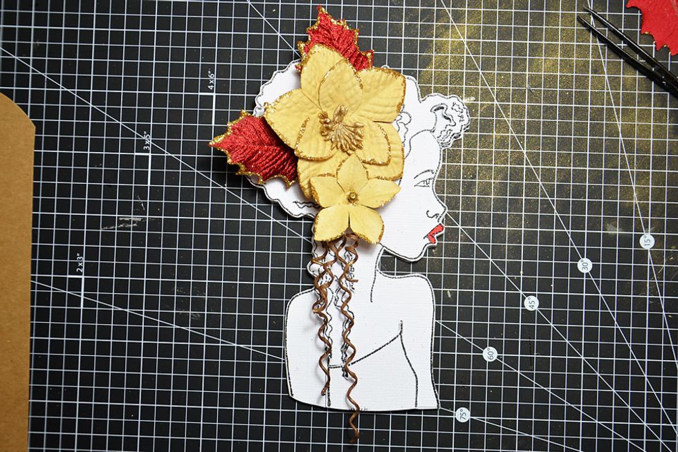 Add the extra flower and 2 extra twisted stem pieces as shown.