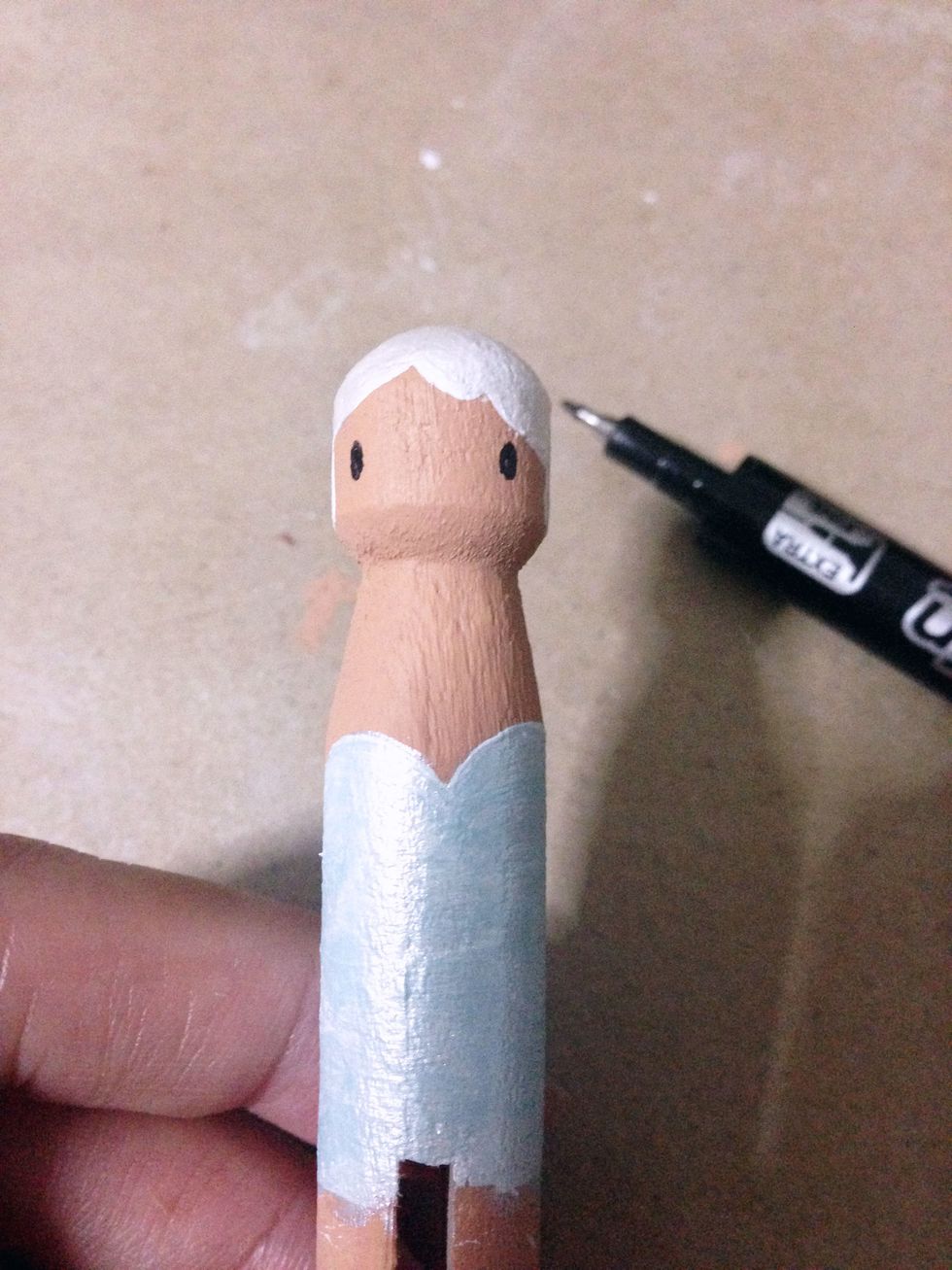 Add the eyes using a black marker... If you would like to, you may add on the mouth... I just find it cuter with only the eyes...