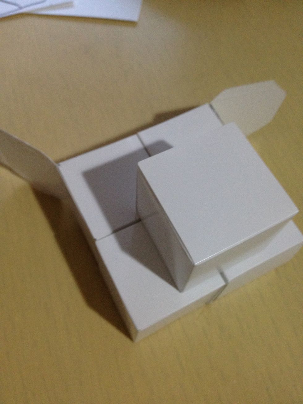 Add the fifth cube on top to make the nose of the dog.