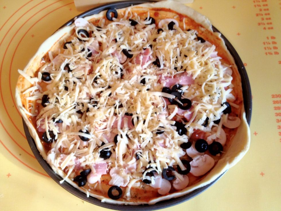 Add the filling and grate the cheese over it.