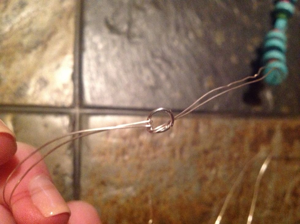 Add the first piece of closure to the end of the wire...fix and position wire as needed to secure the piece in place.