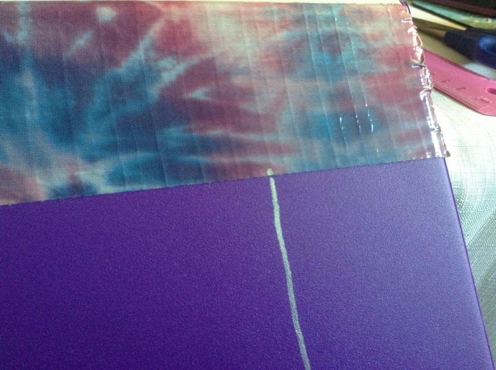 Add the first strip of tape as you did on the other side. Mark a line, wider than the tape, how far down you want the label to go.