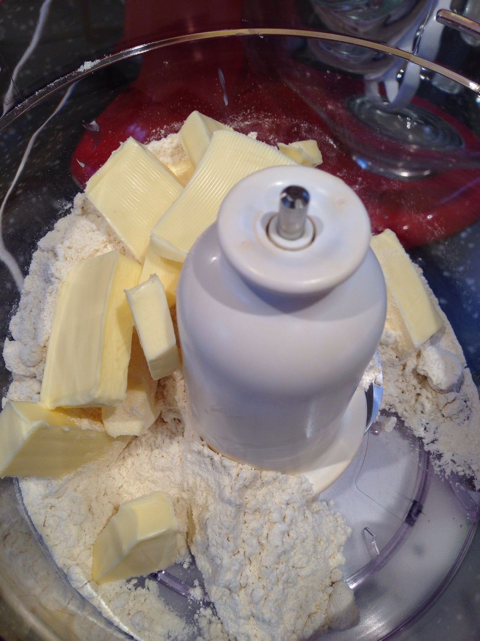 Add the flour and butter to a mixer and mix until it resembles breadcrumbs
