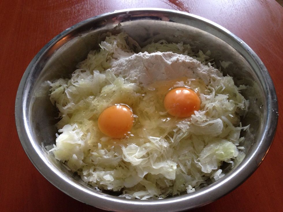 Add the flour and the eggs and mix it up