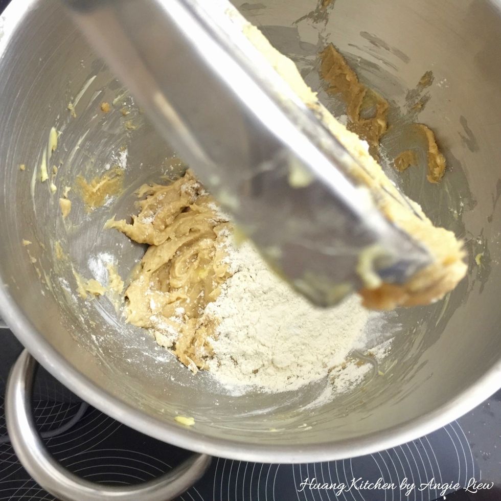 Add the flour mixture to the creamed butter mixture.