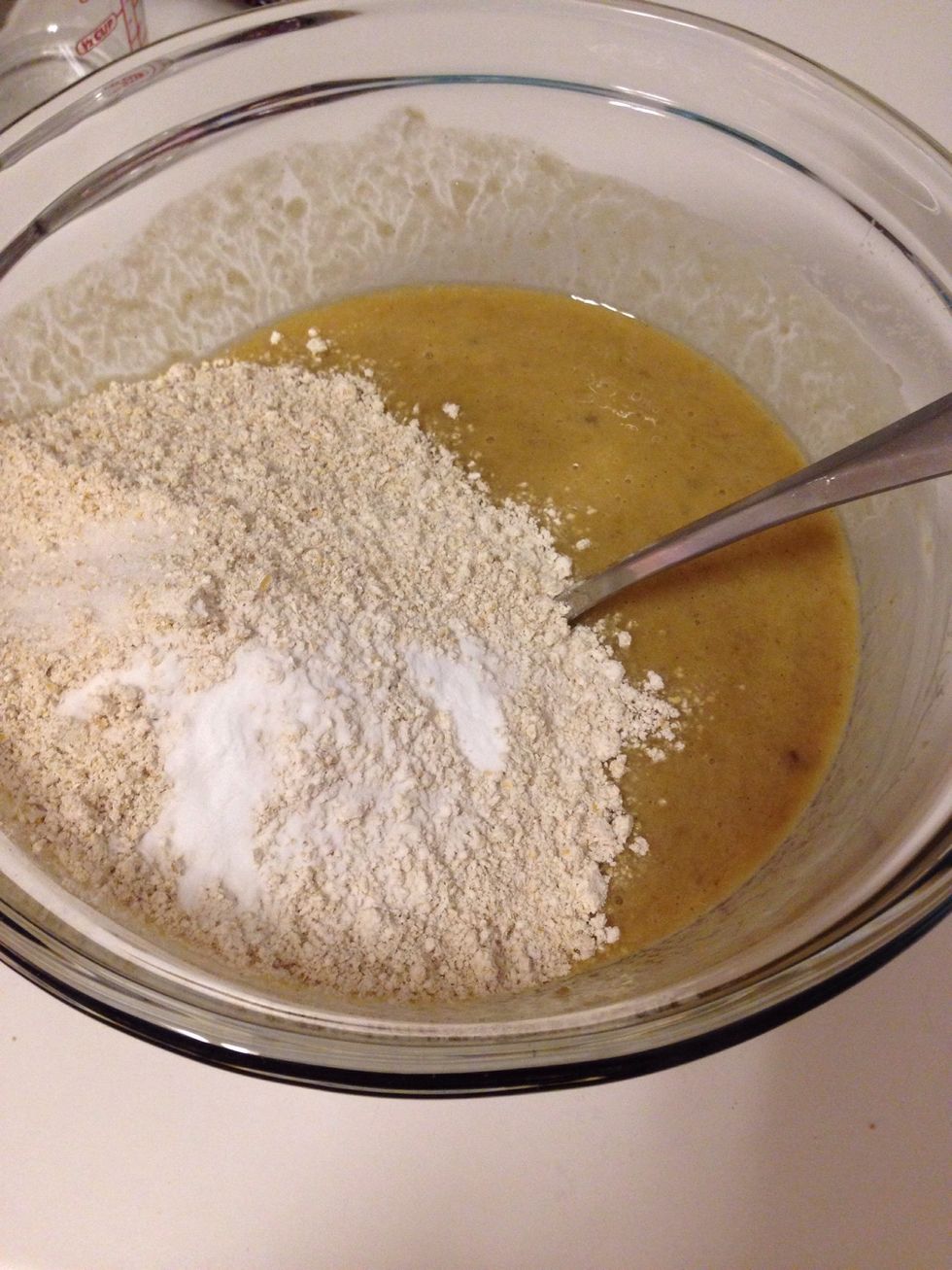 Add the flour, salt, and baking soda to the wet ingredients and stir until JUST combined (over-mixing will lead to a denser bread).
