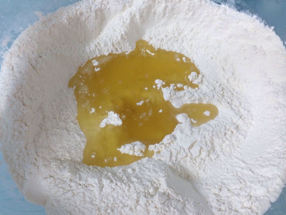 Add the  flour, salt, black pepper, and oil together .