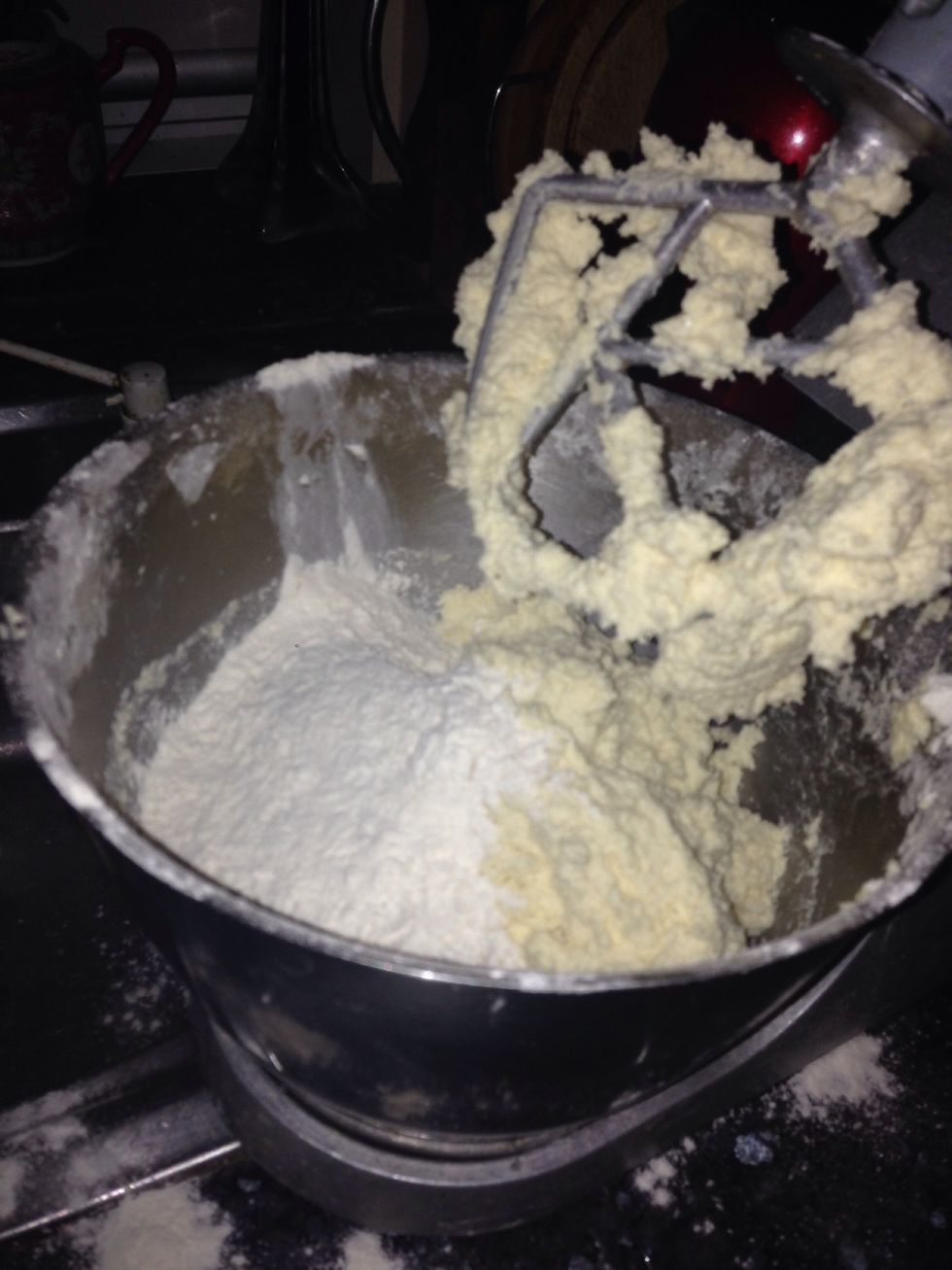 Add the flour to the yoghurt and butter mixture and mix it all together in the electric mixer, mix until the ingredients become doughy