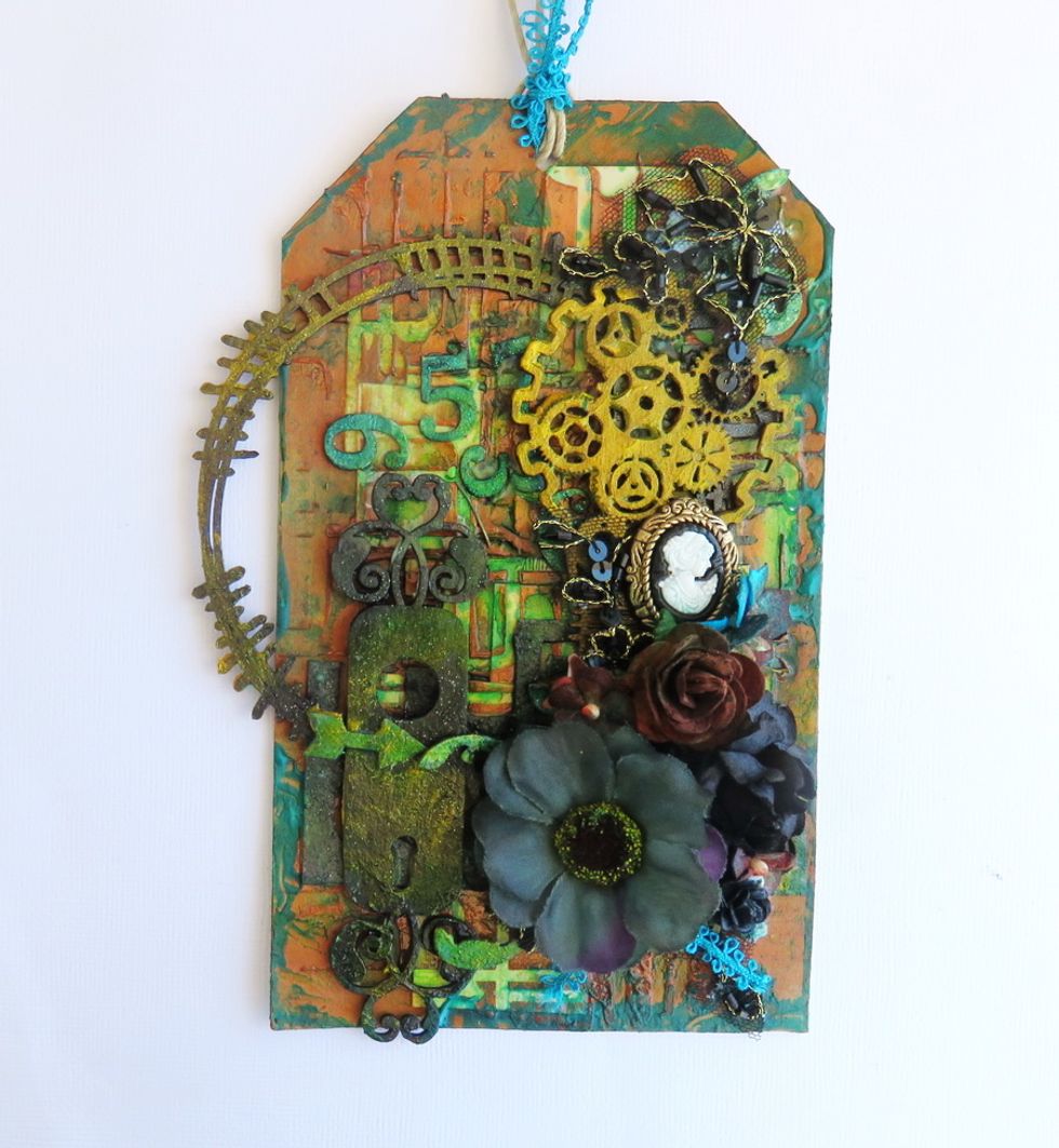 Add the flowers and all other embellishments as shown.