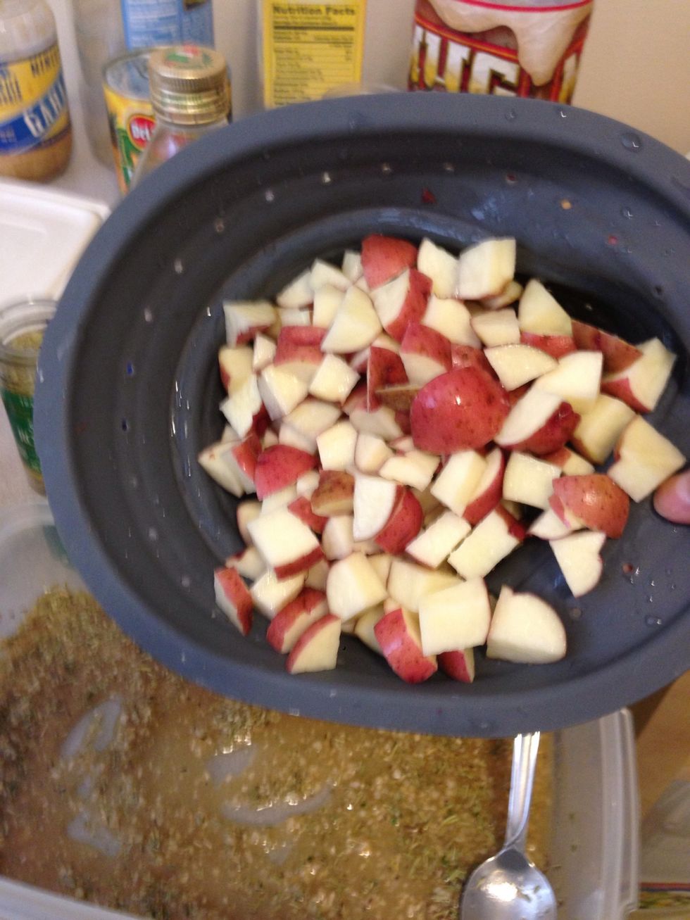Add the freshly washed potatoes to the mixture.