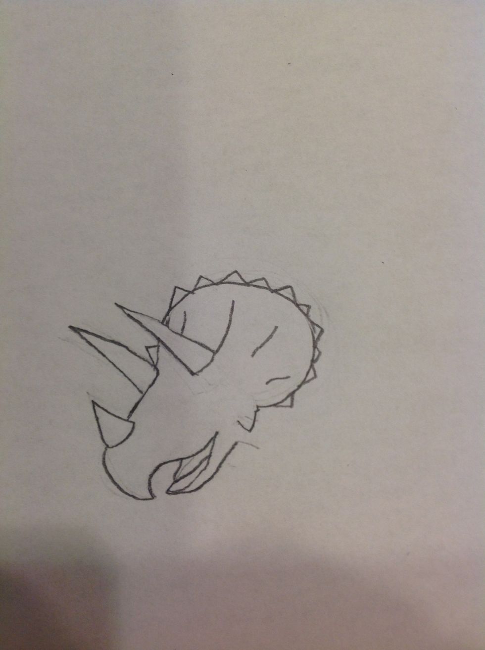 Add the frill and spikes.