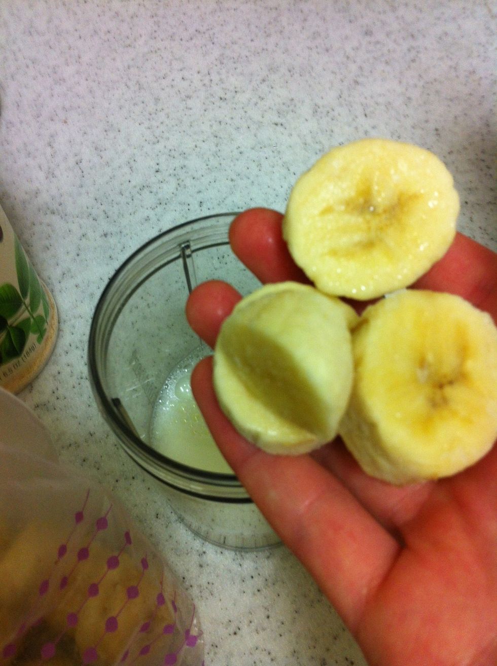Add the frozen banana slices. If you use frozen bananas you don't have to use ice and there is a better texture. But if you don't have frozen bananas ready, you can just use normal ones and add ice.
