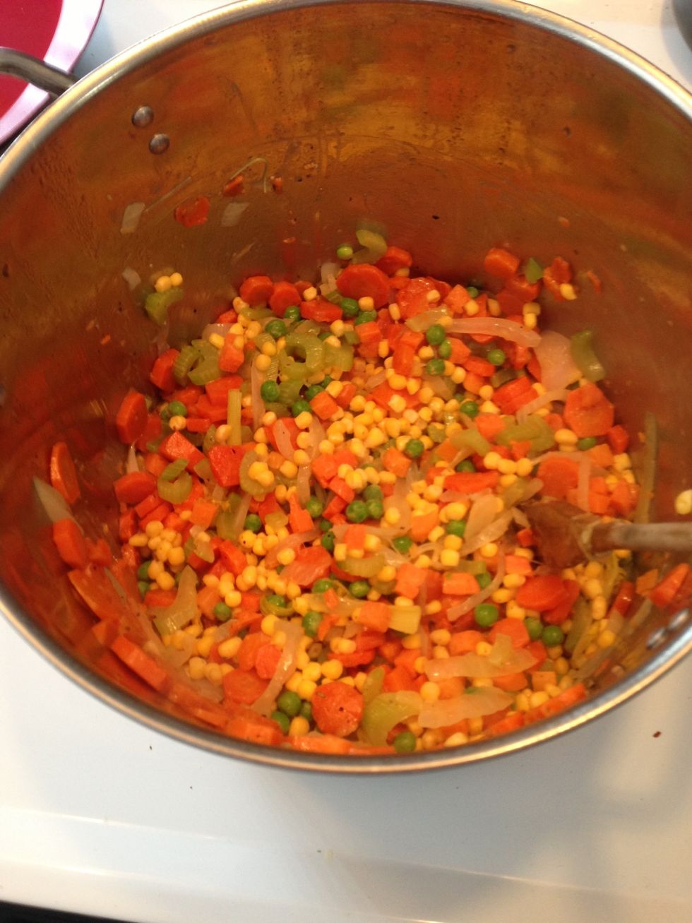 Add the frozen Veg  to the mix. Onions should be translucent.