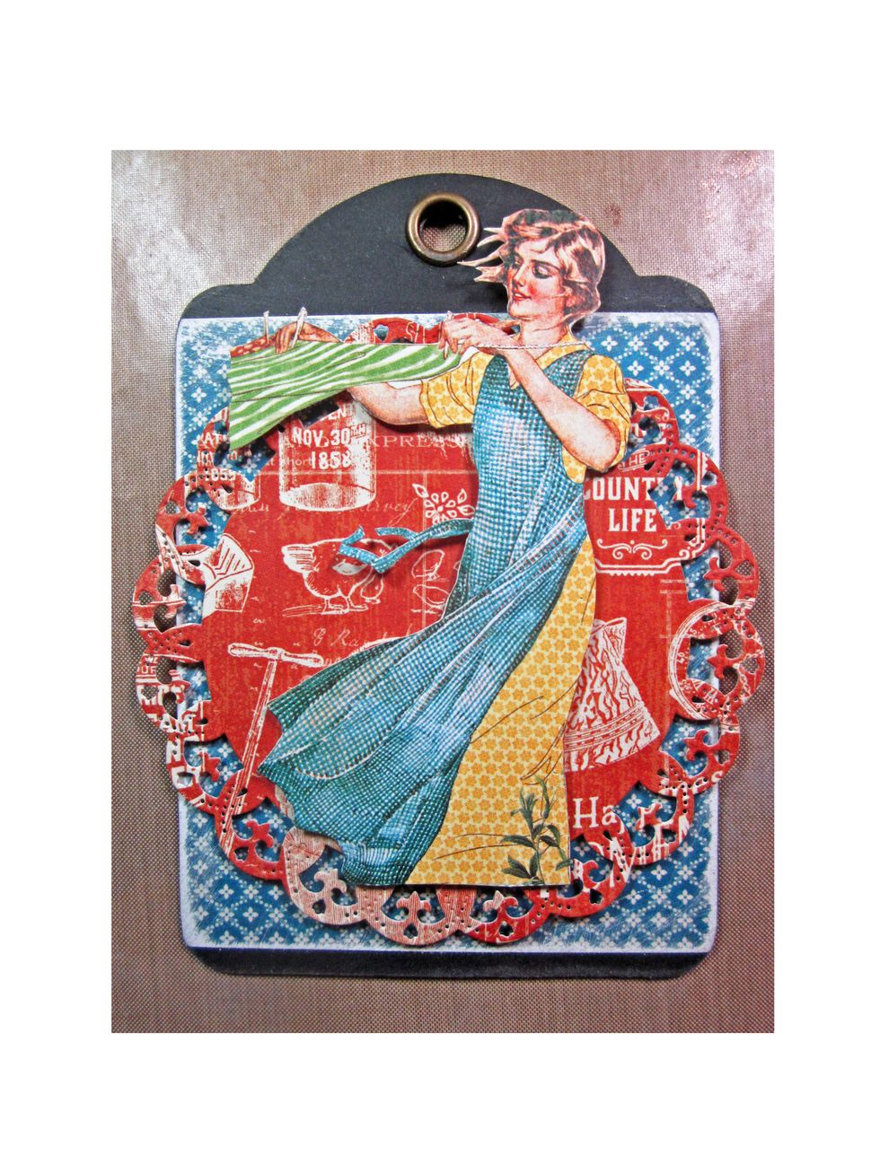 Add the fussy cut figure to the top of the die cut with foam tape.