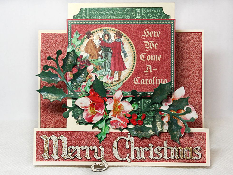 Add the fussy cut flowers and leaves using foam dots to pop up some of the leaves and flower petals. Adhere your sentiment centering in the bottom strip.