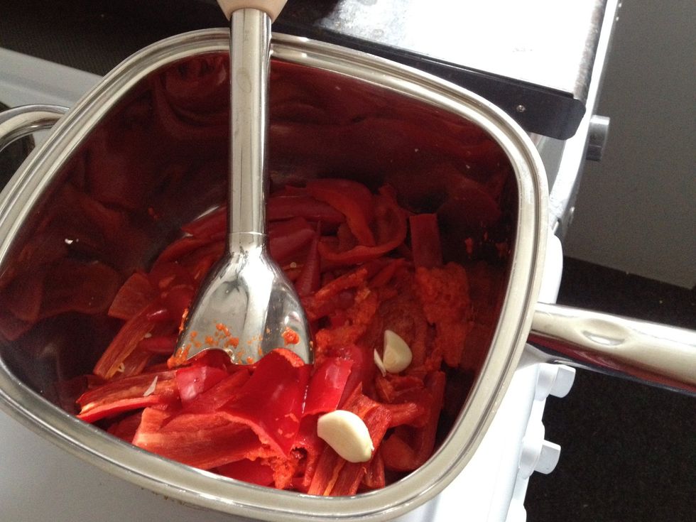 Add the garlic, tomato puree Blend it