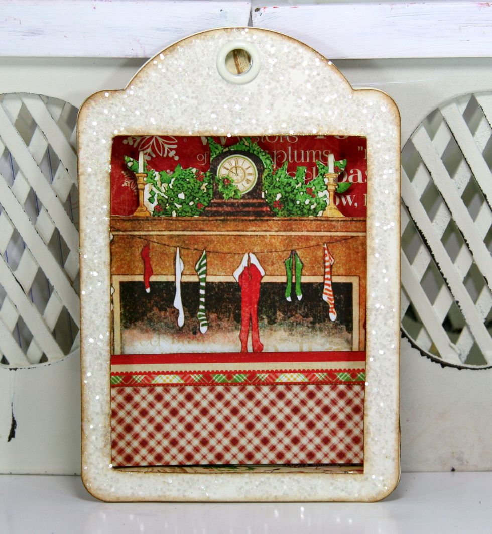 Add the glittered and inked tag and secure firmly.