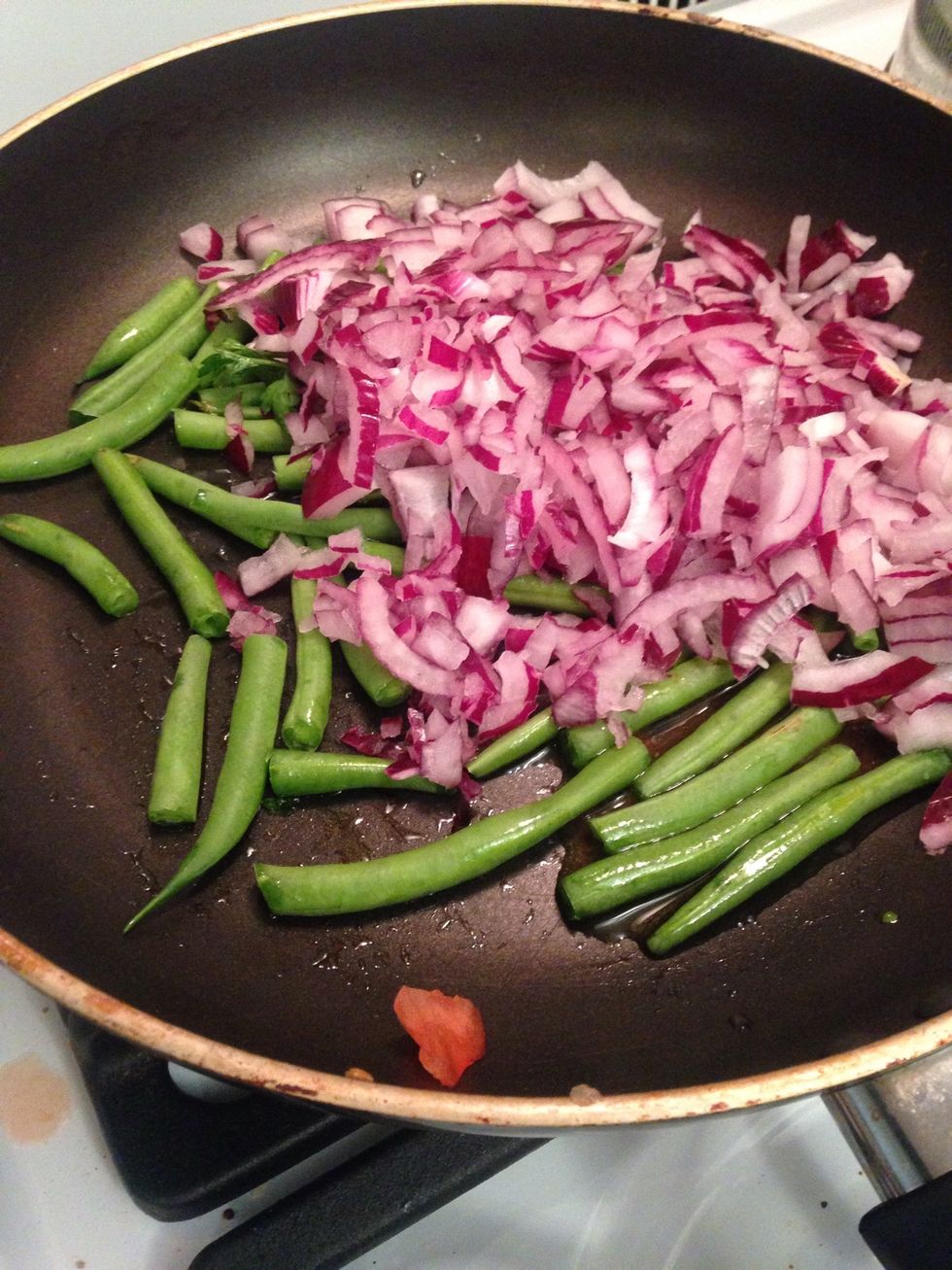 Add the green beans to a hot pan and some olive pull then add onions salt and pepper
