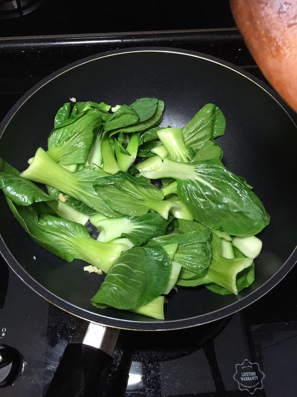 Add the green vegetables and fry for a minute.