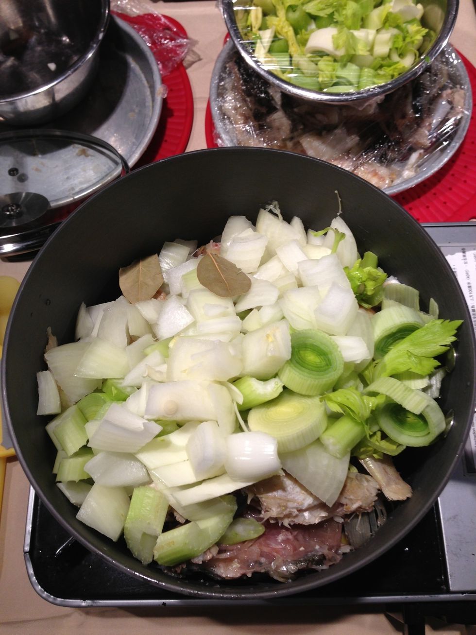 Add the greens such as celery, leaks and onions.  Add bay leaf, white peppers