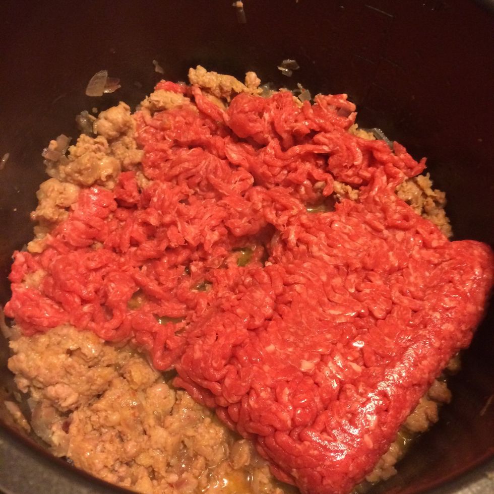 Add the ground beef and brown, also breaking up into small pieces.