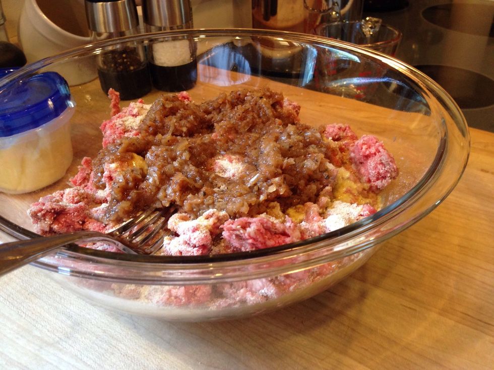 Add the ground chuck, 2 beaten eggs and bread crumbs, and cooled onion mixture in a large bowl.