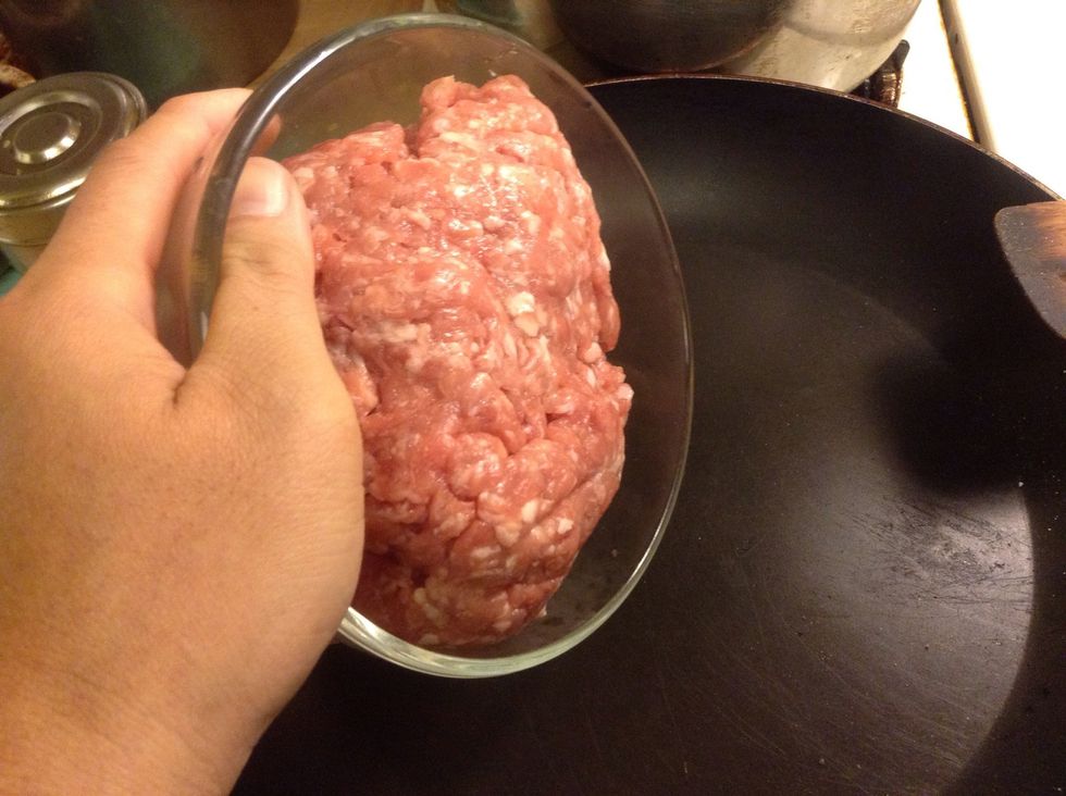 Add the ground pork to a hot pan.