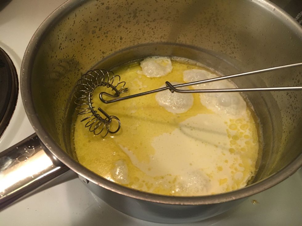 Add the heavy cream. There's no need to whisk, just stir with a spoon.