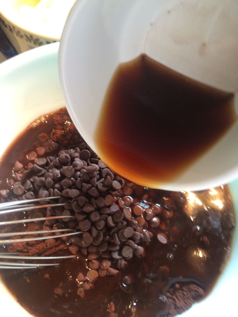 Add the hot coffee to the cocoa and chocolate chips.