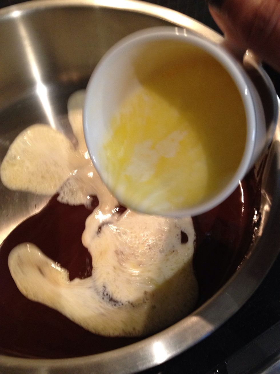 Add the hot cream mixture to the chocolate and let sit for a few seconds without stirring - the idea is to let the ingredients all get acclimatized to each other and get to the same temperature.