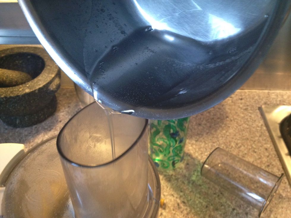Add the hot sirup to the almond flour with the machine running.