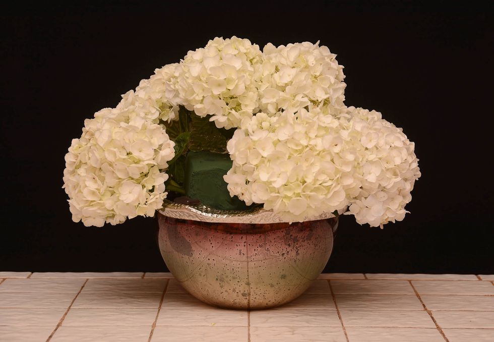 Add the hydrangea around towards the front\u2026 almost completing the circle\u2026.