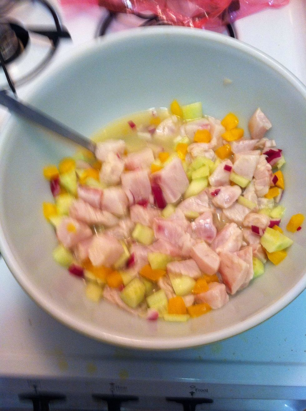 Add the juices, and any and all veggies you prefer. I use onion, peppers, and cucumbers and eat with tortilla chips. The acid in the juice cooks the fish. Let refrigerate for 4-6 hours and ENJOY!