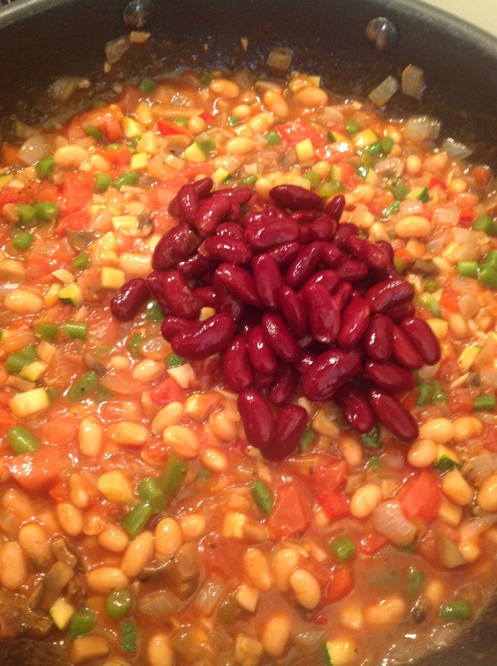 Add the kidney beans, making sure to rinse them beforehand. Stir. And continue to cook on a medium to low heat for a few more minutes.