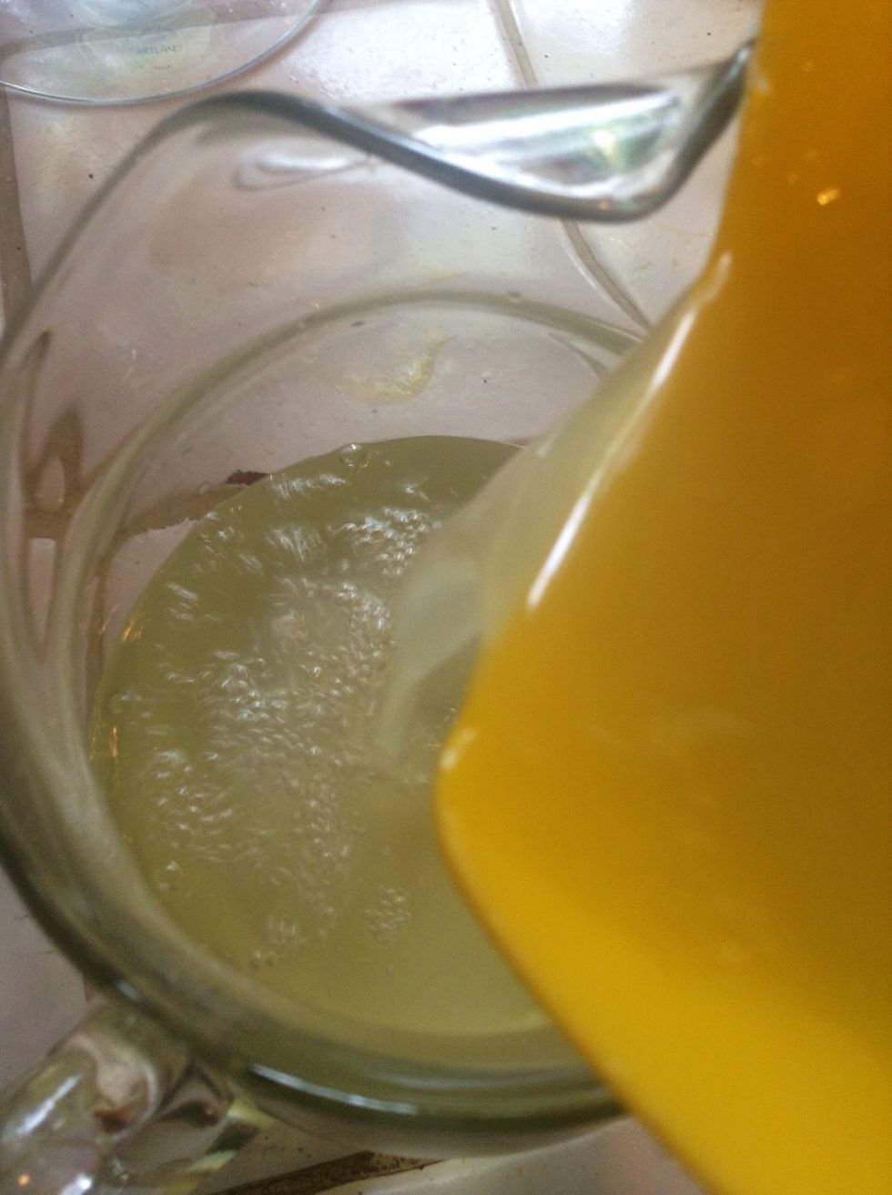 Add the lemon juice to the water and sugar in the carafe..