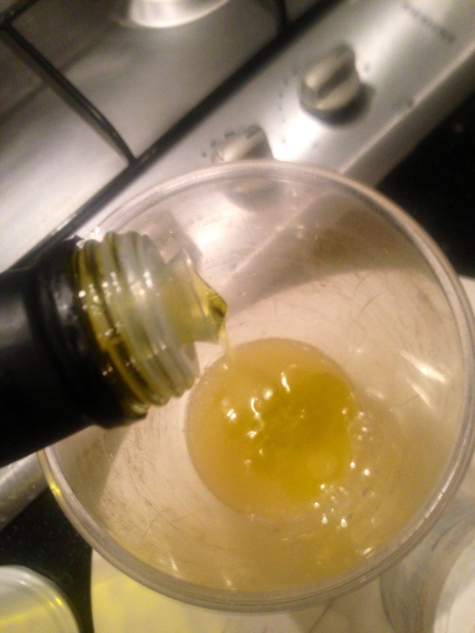 Add the lemons juice first then the virgin olive oil