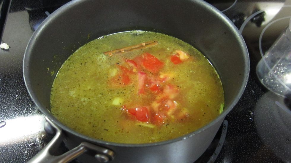 Add the lentil, 3 cups of water and chopped tomato and cook for about 20 minutes. Add salt to taste after 20 minutes. The lentils should be cooked into a soft consistency. Add more water if necessary.