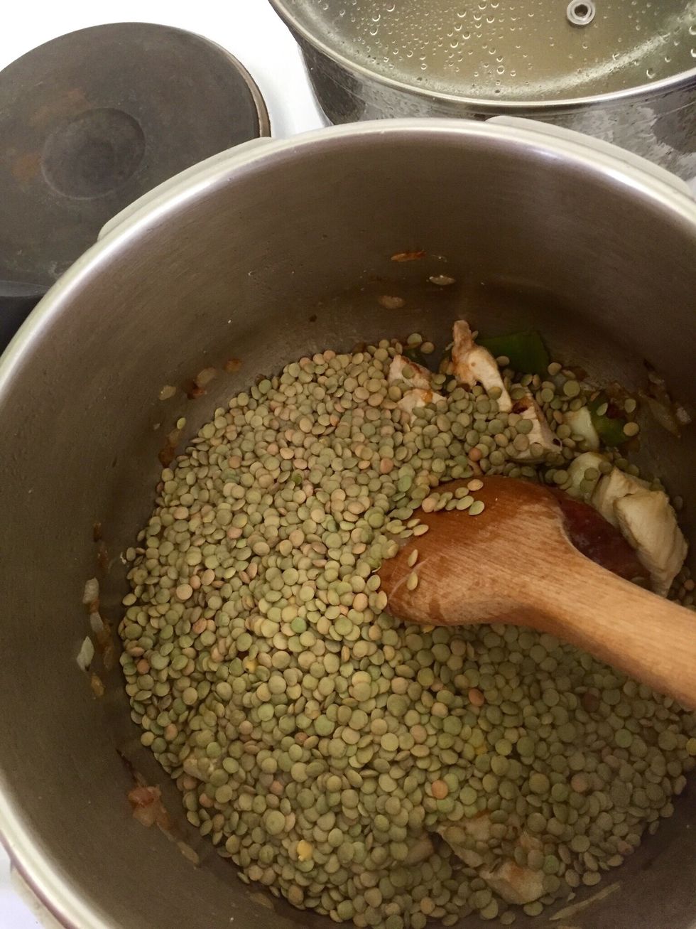 Add the lentils and stir. I use a pressure cooker for this. If you don't have one, you can cook it but it will take a lot longer