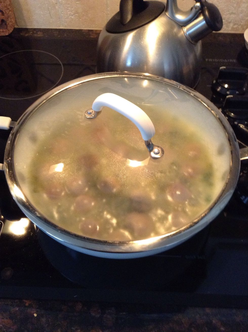 Add the lid & let simmer 5-8 minutes, giving the clams an opportunity to cook & open up. Give a little shimmy/shake mid way to get those clams evenly distributed over heat.