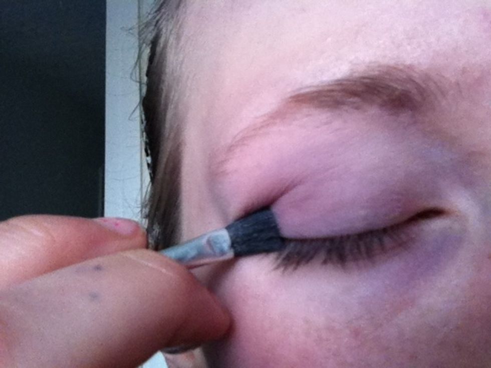 Add the light shade to eyelid and beneath eyebrow