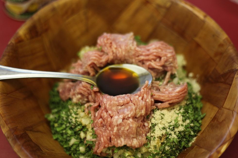 Add the light soy sauce. Two tablespoons should do it.