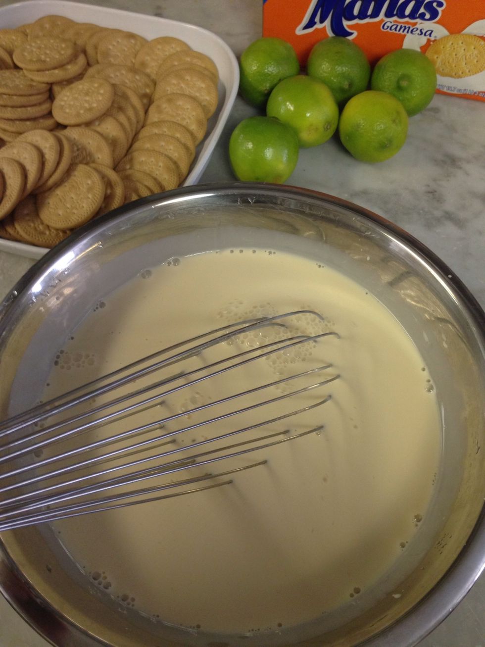 Add the lime juice little by little and whisk together, you will notice that it will star to thicken