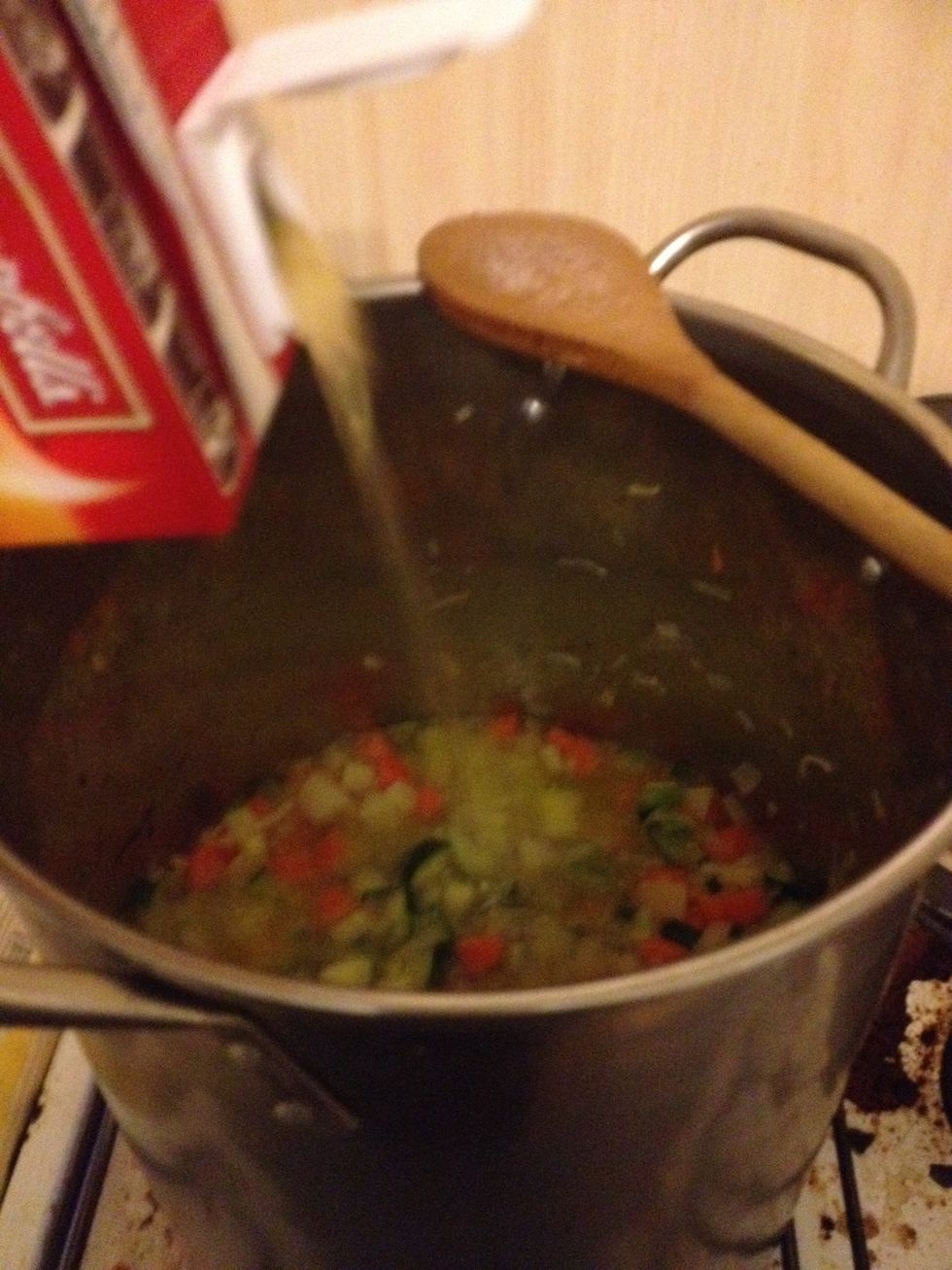 Add the litre of of stock, and the diced tomatoes. Stir and cover. After about 10 minutes, add the lentils.