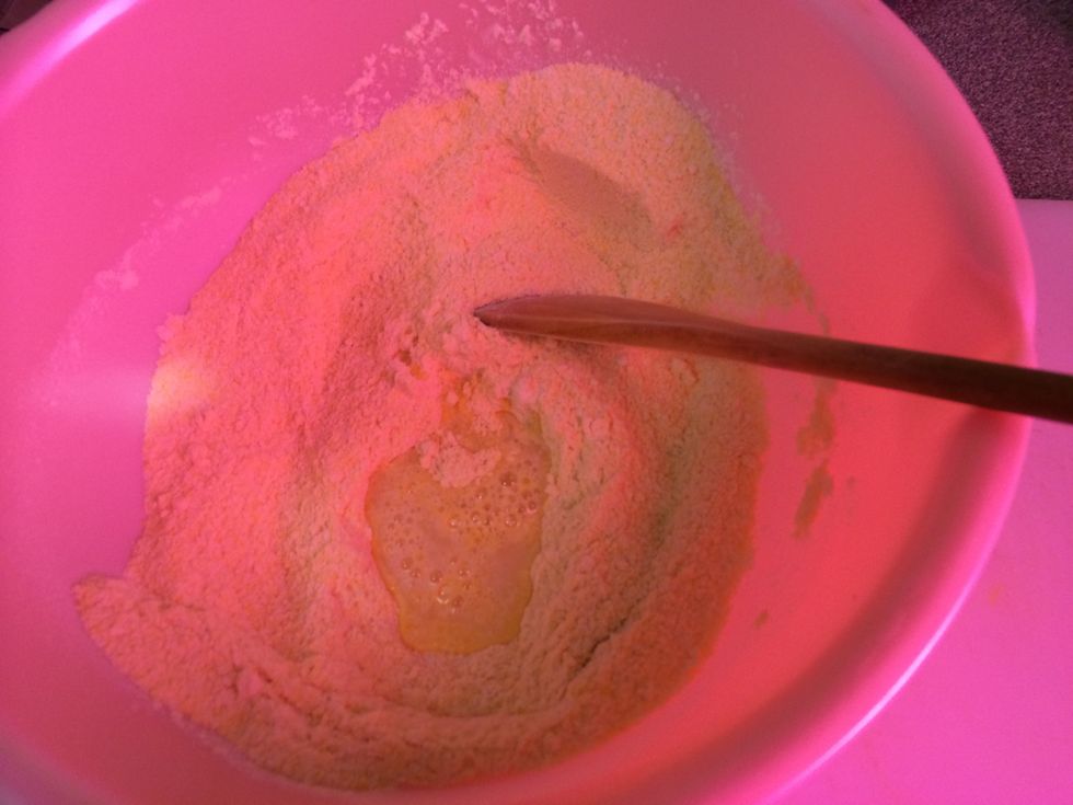 Add the lukewarm water intermittently until dough has combined.