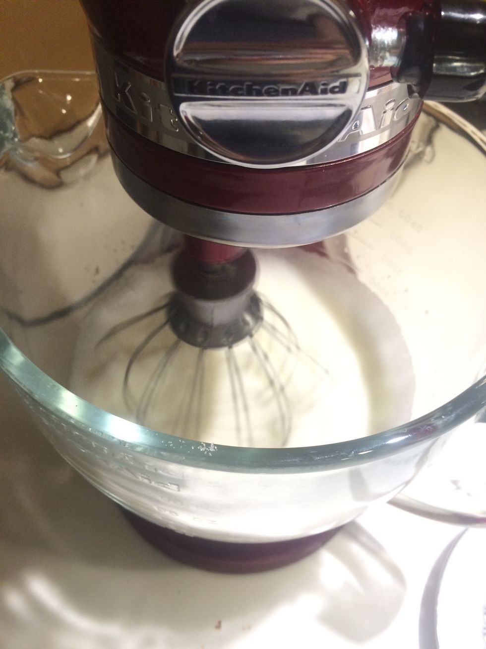 Add the mascarpone cheese slowly into the egg white cream while the mixer blends everything together (in the same direction). The cream will become thicker. Blend until there are no more lumps.