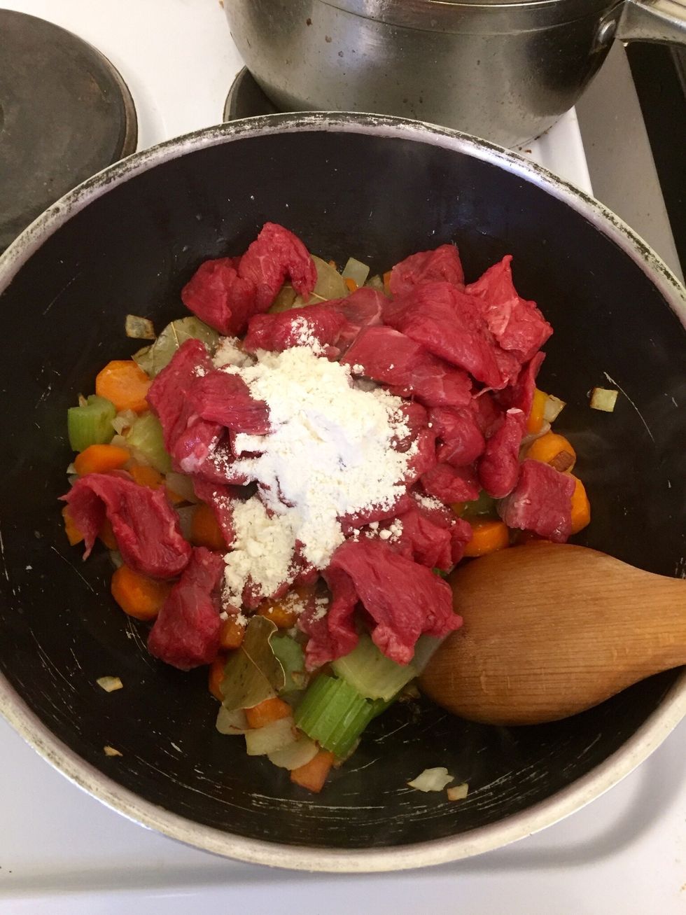 Add the meat and the flour
